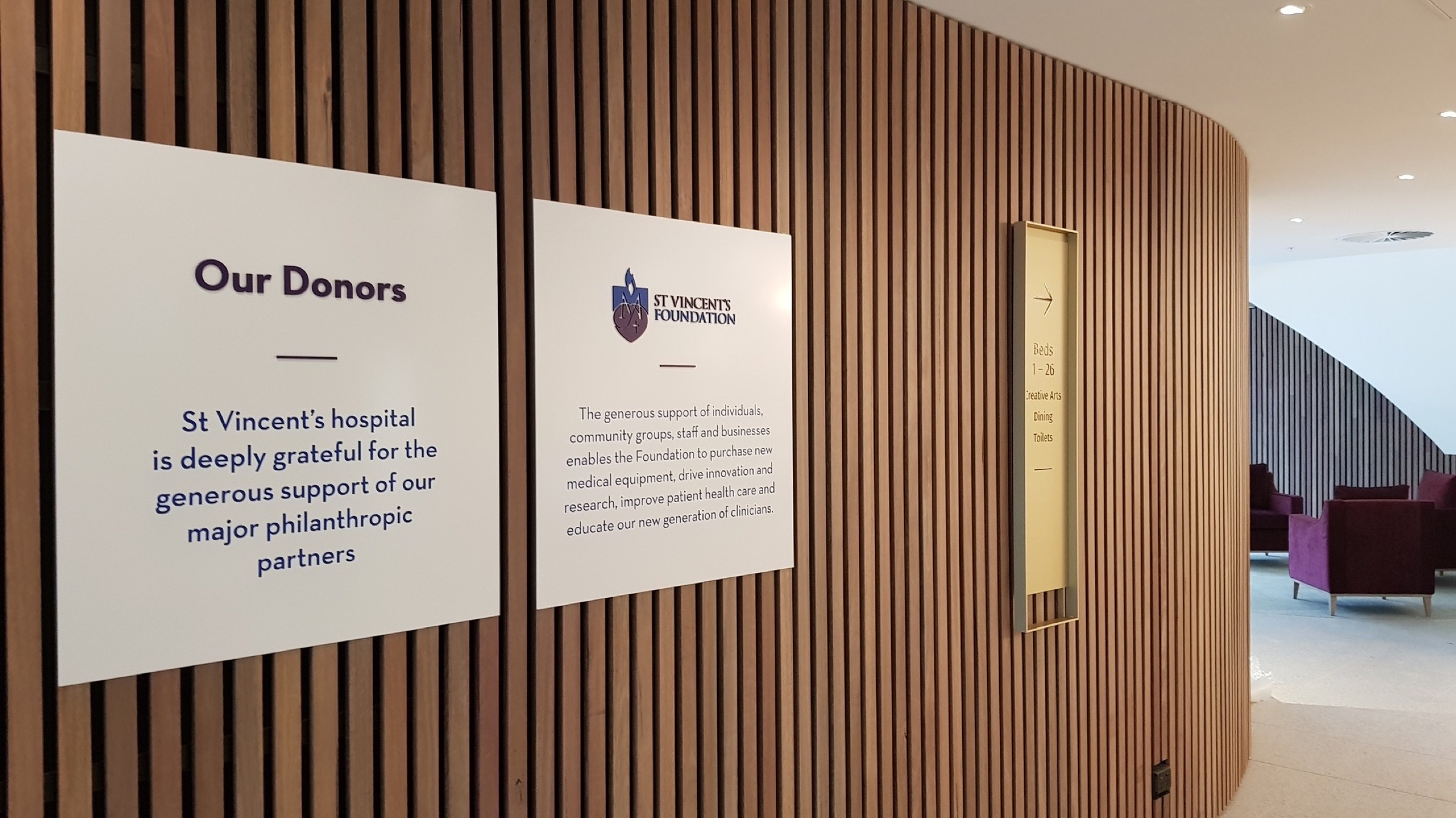 Caritas Christi internal donor wall signage