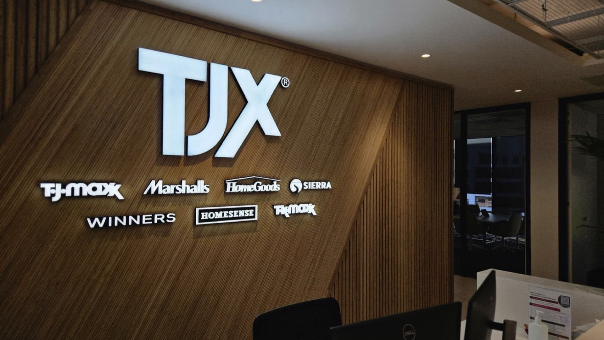 Multi-brand corporate reception signage delivered by Insigns