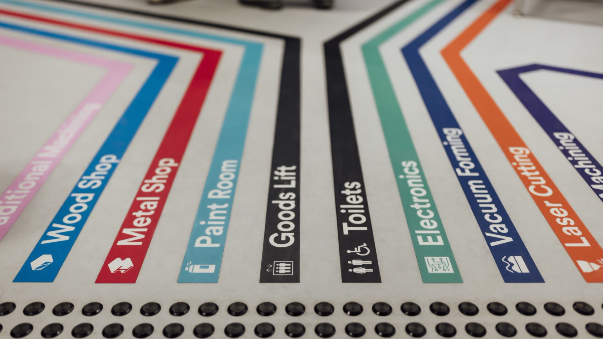Colour-coded directional and tactile wayfinding sign samples
