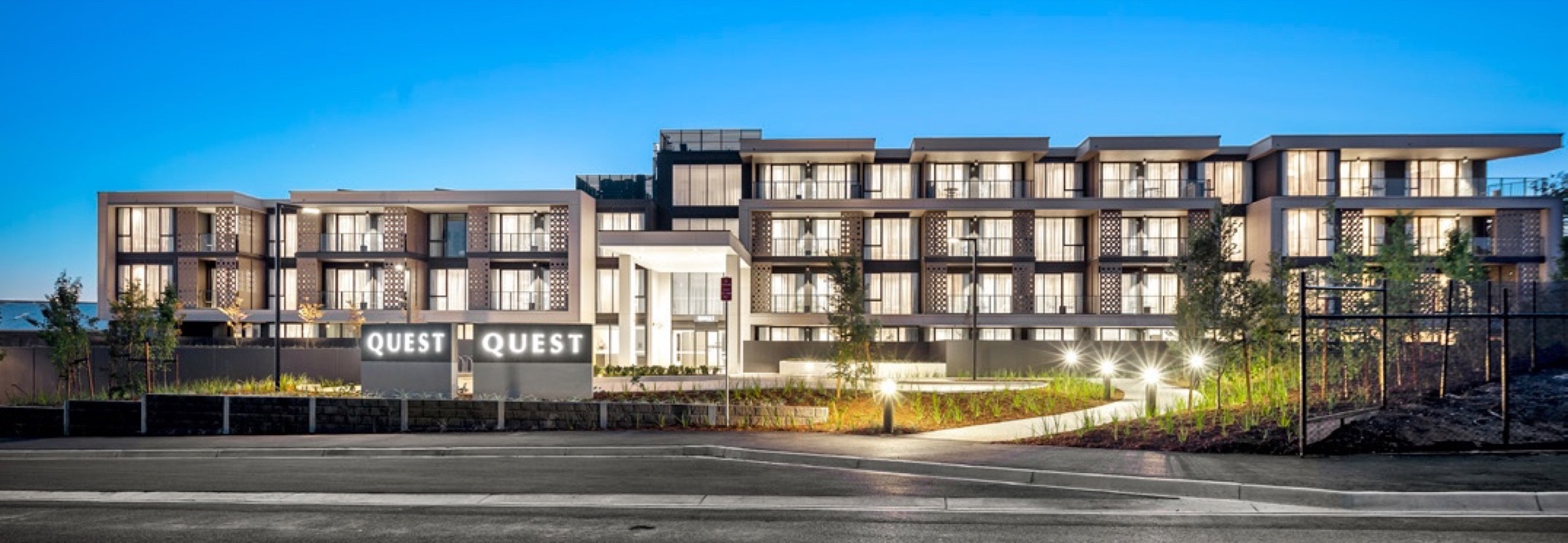 Quest Apartments commercial frontage signage